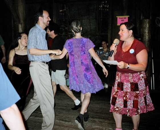 A Caller and People Dancing